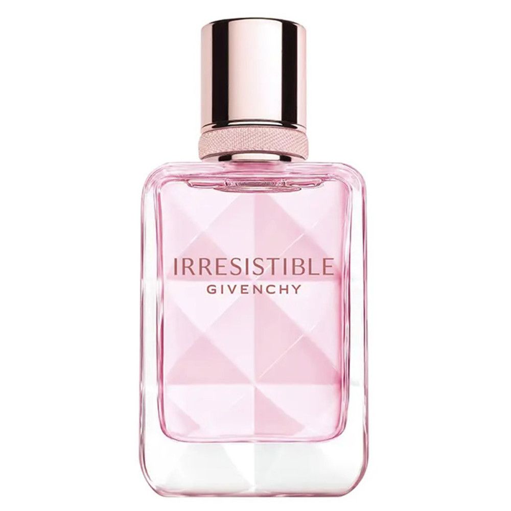 Roze parfumfles met dop. Opschrift: Irresistible, Givenchy. Geometrisch design. Transparante glazen fles.