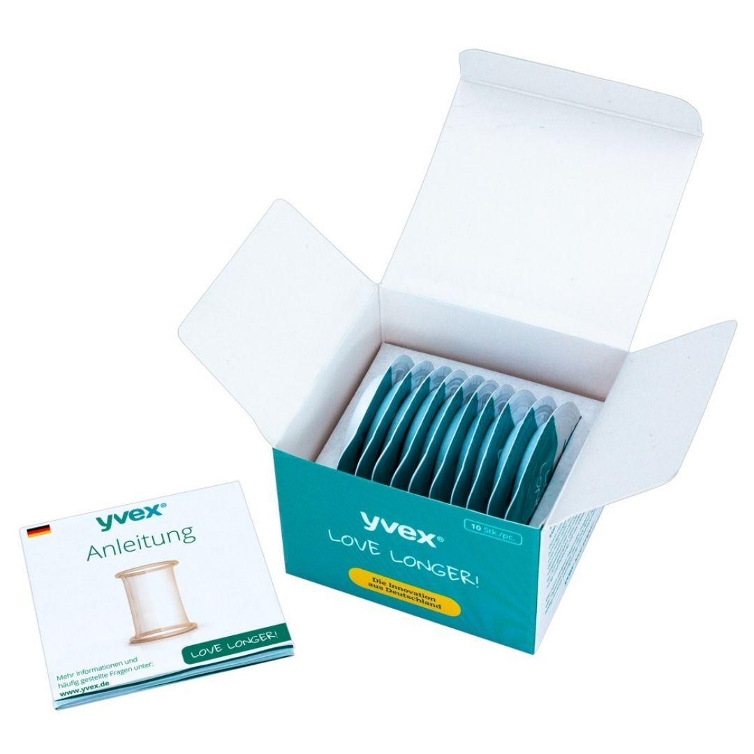 Open productverpakking met individuele verpakkingen. Instructies en product. Opschrift "yvex LOVE LONGER!".