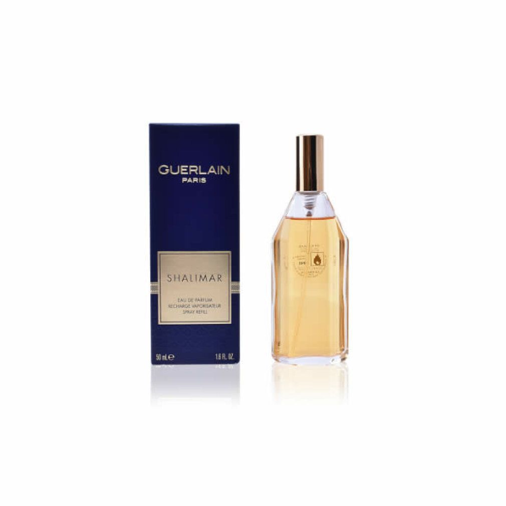 Boîte bleue foncée et flacon. GUERLAIN PARIS et SHALIMAR sur la boîte. Flacon transparent avec bouchon doré.