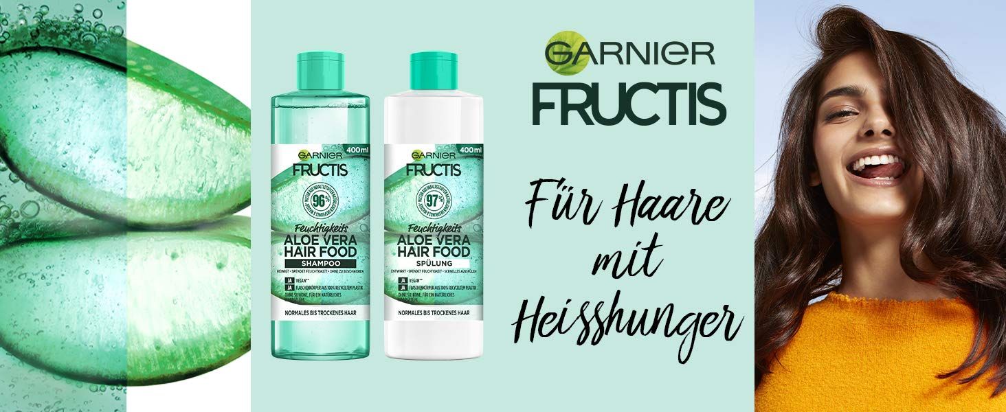 Bannière avec flacons de shampooing Garnier Fructis et femme aux cheveux brillants. Texte : Pour cheveux affamés.