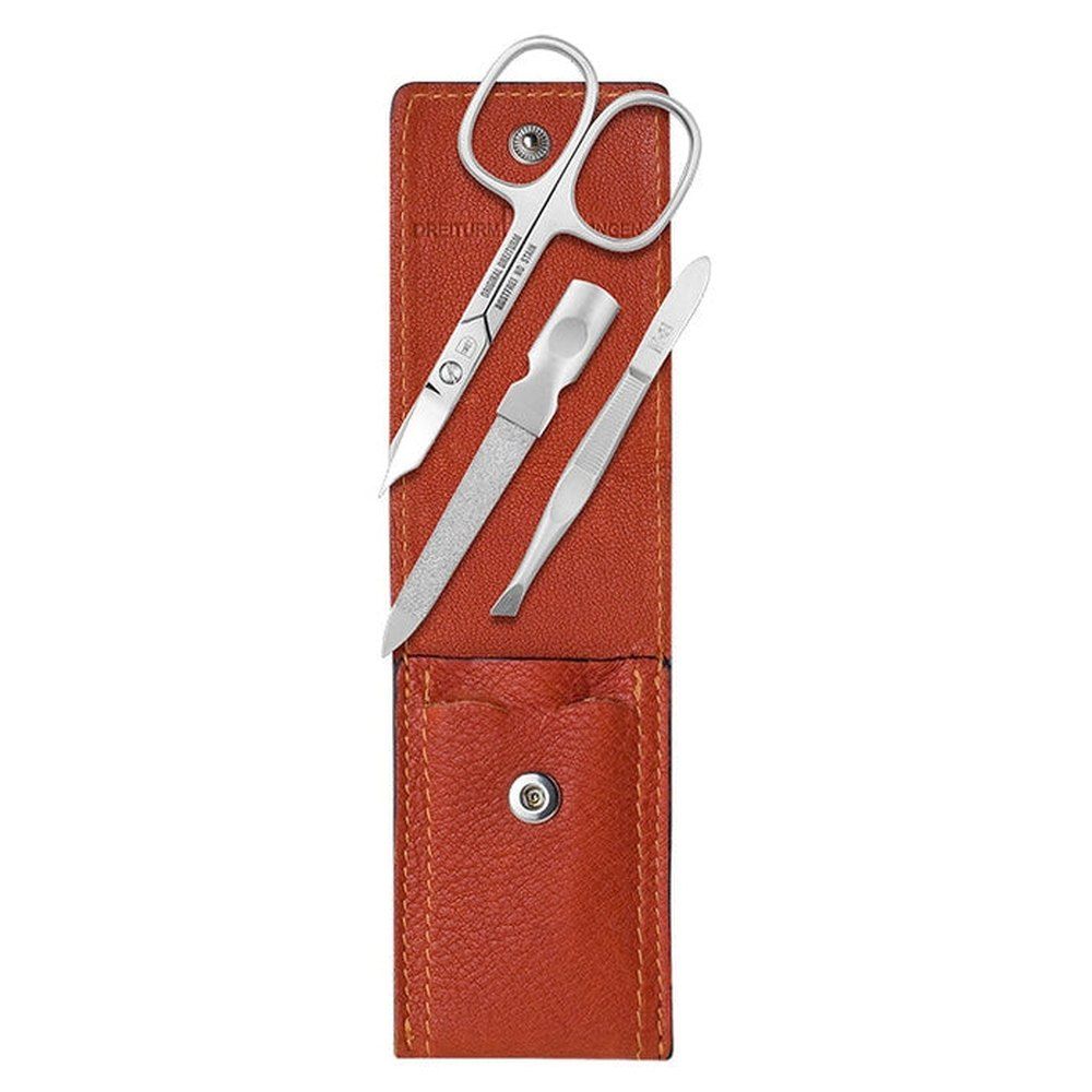 Manicure set met schaar, vijl, pincet en tool in bruine etui. Gereedschap van metaal.