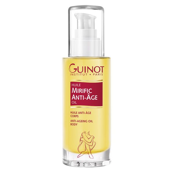 Flacon d'huile pour le corps avec pompe. Inscription : GUINOT, MIRIFIC ANTI-ÂGE OIL. Liquide jaune, flacon transparent, tête de pompe blanche.