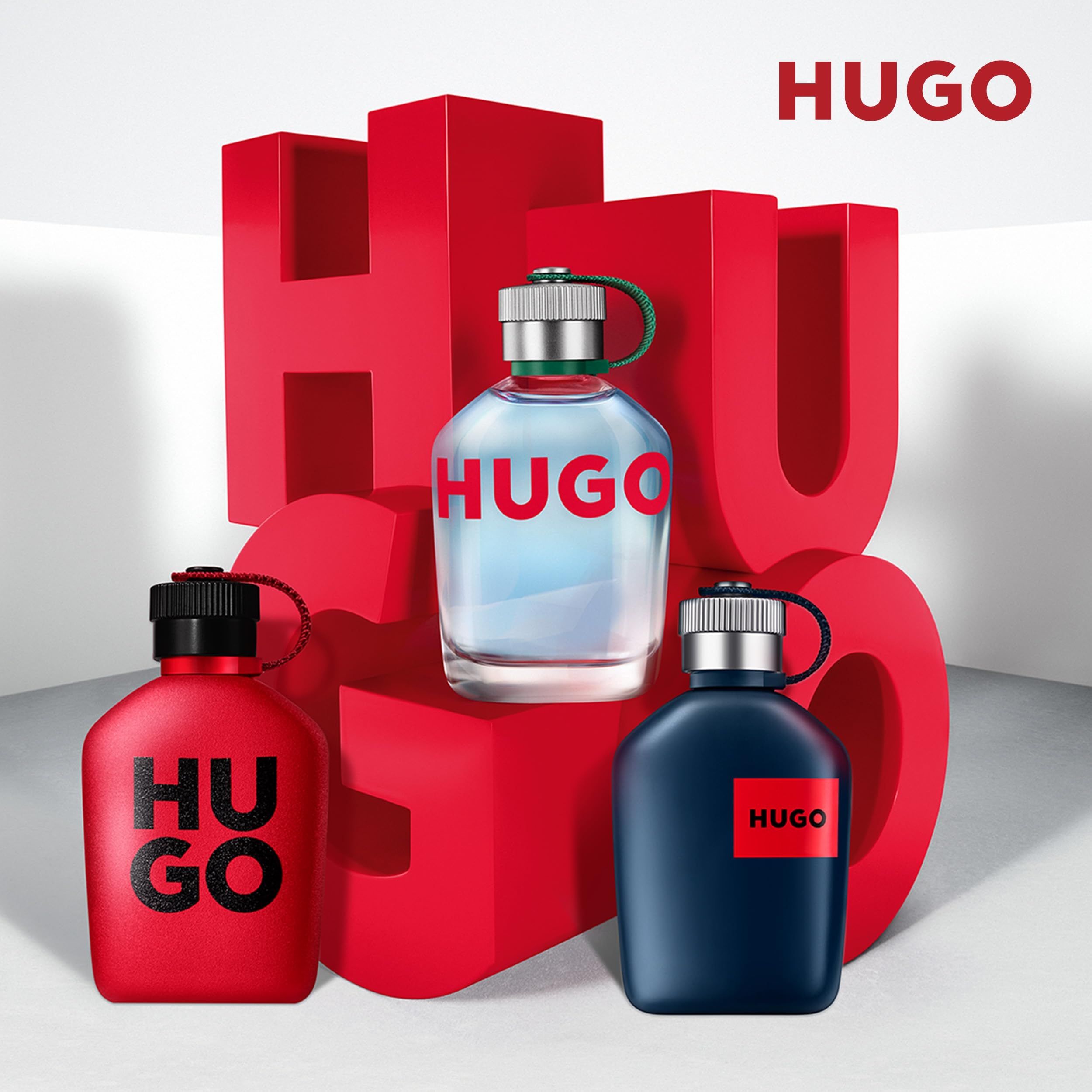 Drie Hugo parfumflessen: een rode, een blauwe en een doorzichtige met blauwe inhoud.