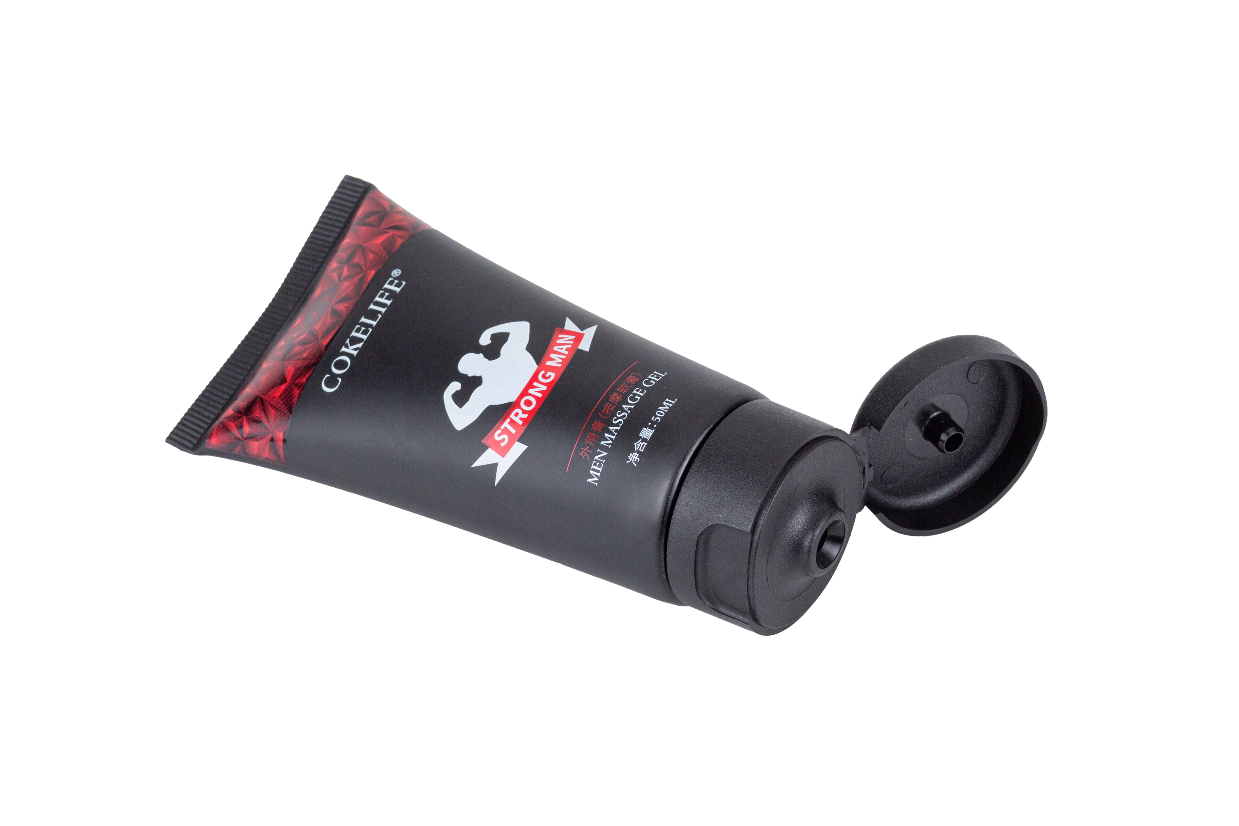Tube noir avec impression rouge et bouchon noir. Inscription: COKELIFE STRONG MAN.