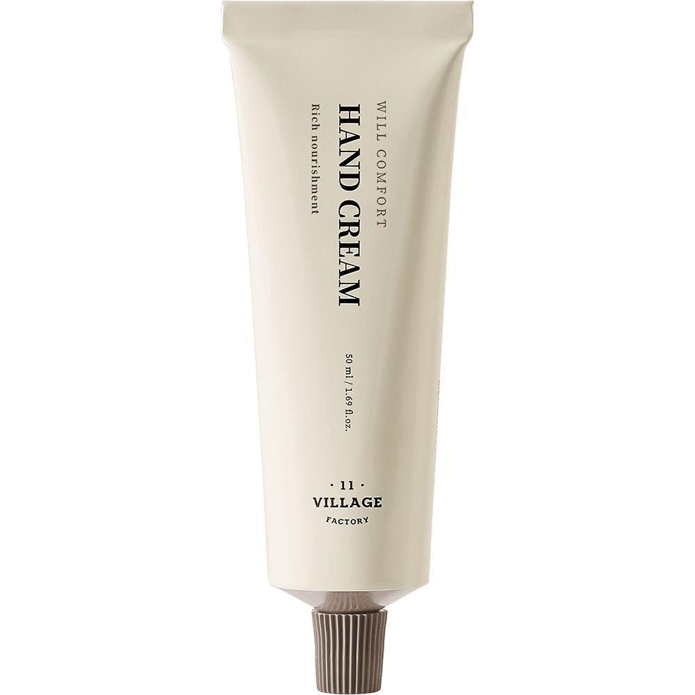 Handcrèmetube met tekst HAND CREAM, WILL COMFORT, VILLAGE FACTORY. Beige tube met bruine dop.