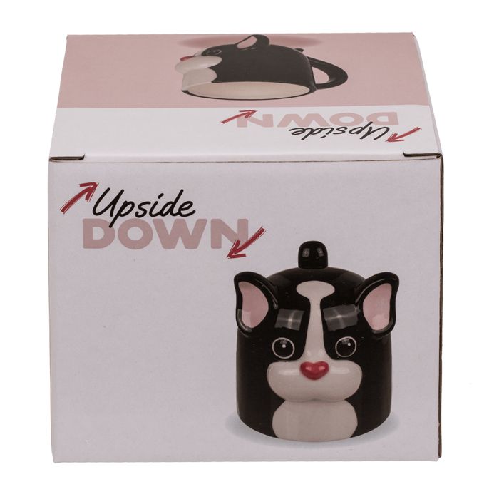 Verpakking met afbeelding van zwarte beker met wit gezicht. Opschrift 'Upside DOWN'.