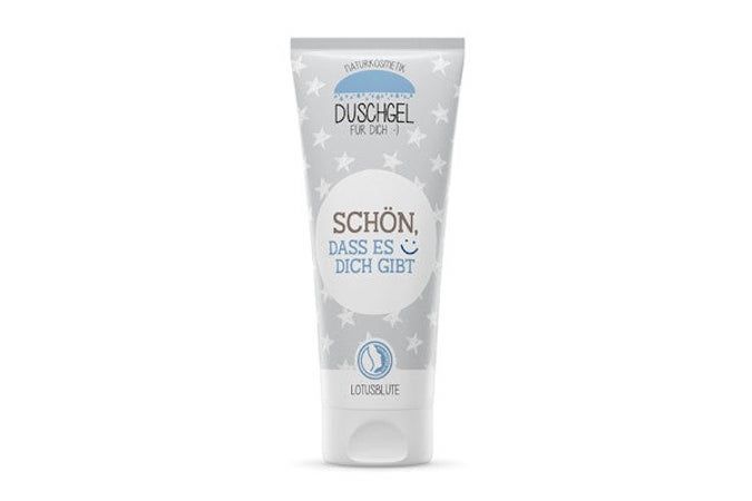 Tube de gel douche à motifs étoiles. Texte : "Schön, dass es Dich gibt". En bas : "Lotusblüte".