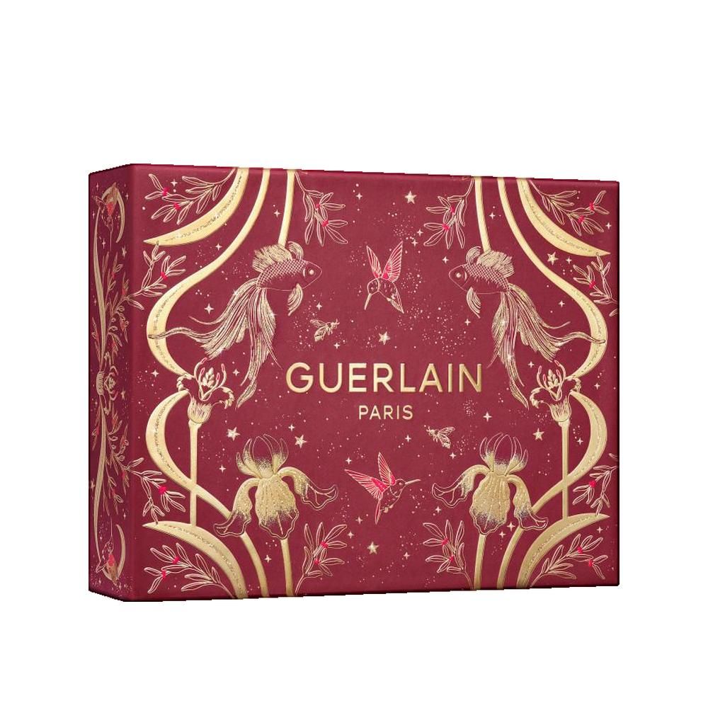 Rode geschenkverpakking met gouden versieringen. Opschrift: GUERLAIN PARIS. Versieringen: vissen, bloemen, vogels. Rechthoekige vorm.