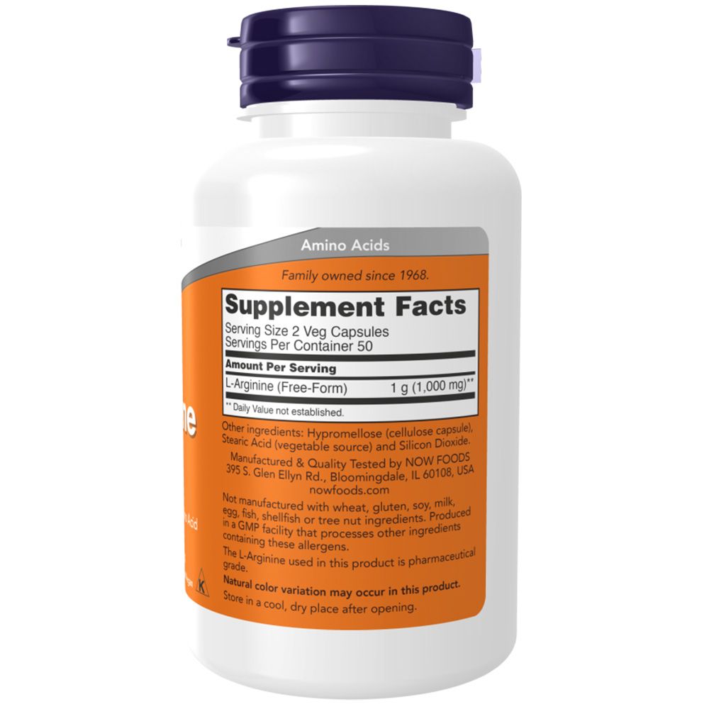 Witte fles met oranje etiket. Opschrift: L-Arginine, 1g. Blauwe dop. Bevat 50 capsules. NOW FOODS.