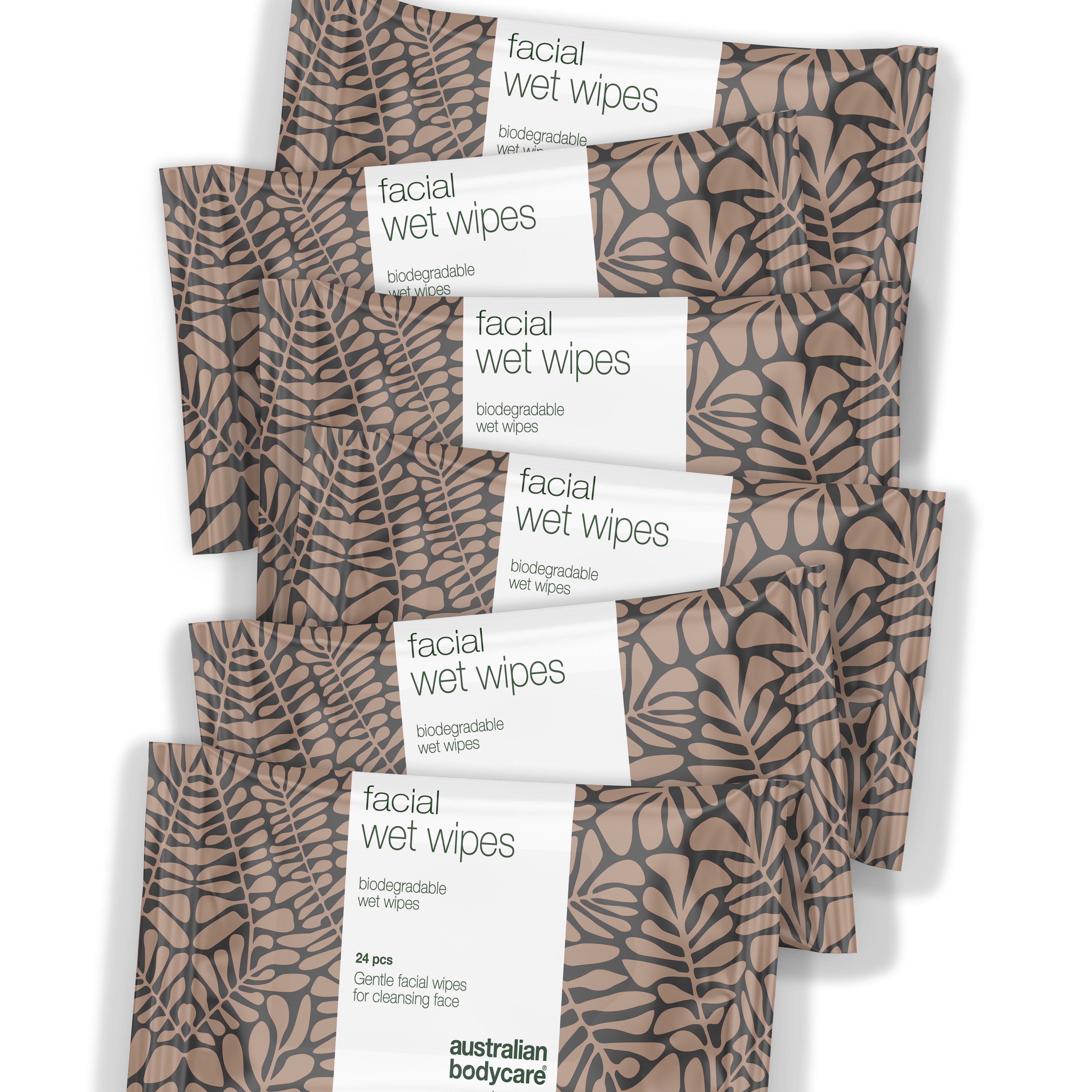 Plusieurs paquets de lingettes démaquillantes. Emballage à motifs de feuilles. Inscription : facial wet wipes.