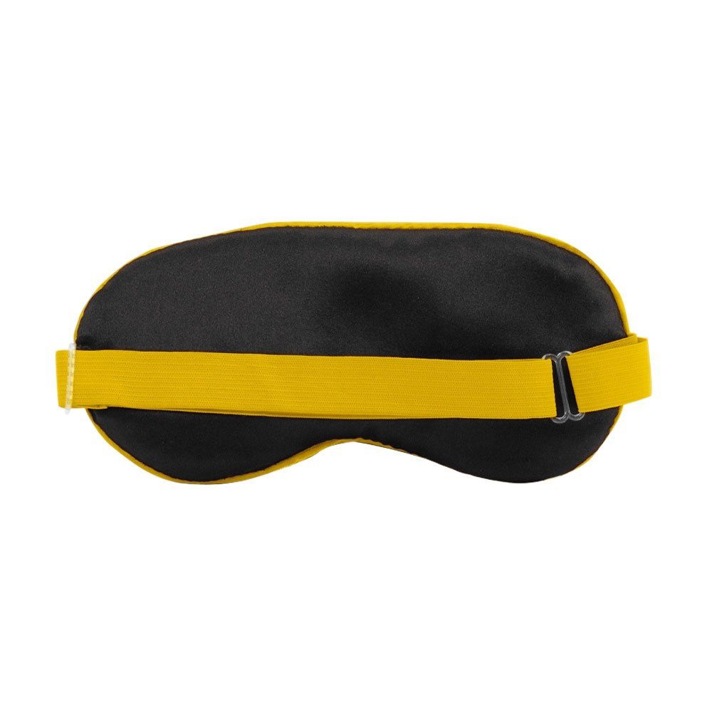 Achterkant van een slaapmasker. Zwart masker met gele band en sluiting. Elastische band.