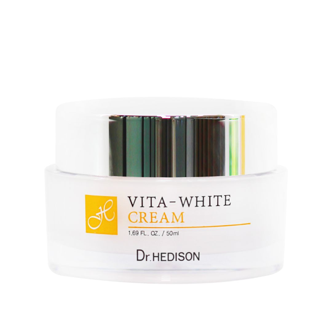 Pot de crème avec couvercle blanc. Inscription : VITA-WHITE CREAM, 1.69 FL. OZ. / 50ml, Dr. HEDISON. Logo jaune.