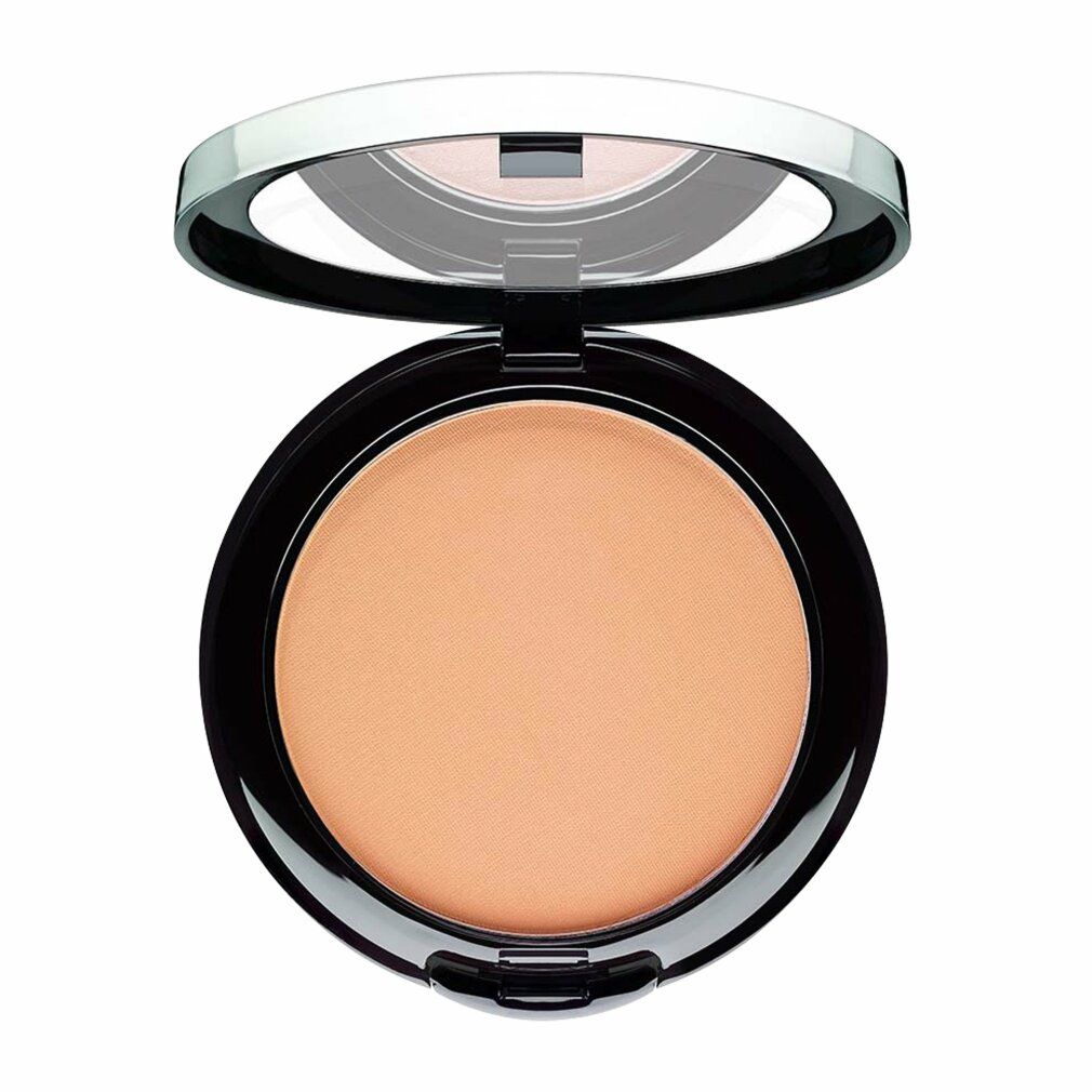 Poudre compacte ronde, ouverte. Boîtier noir avec bord argenté. Miroir dans le couvercle. Poudre couleur peau.