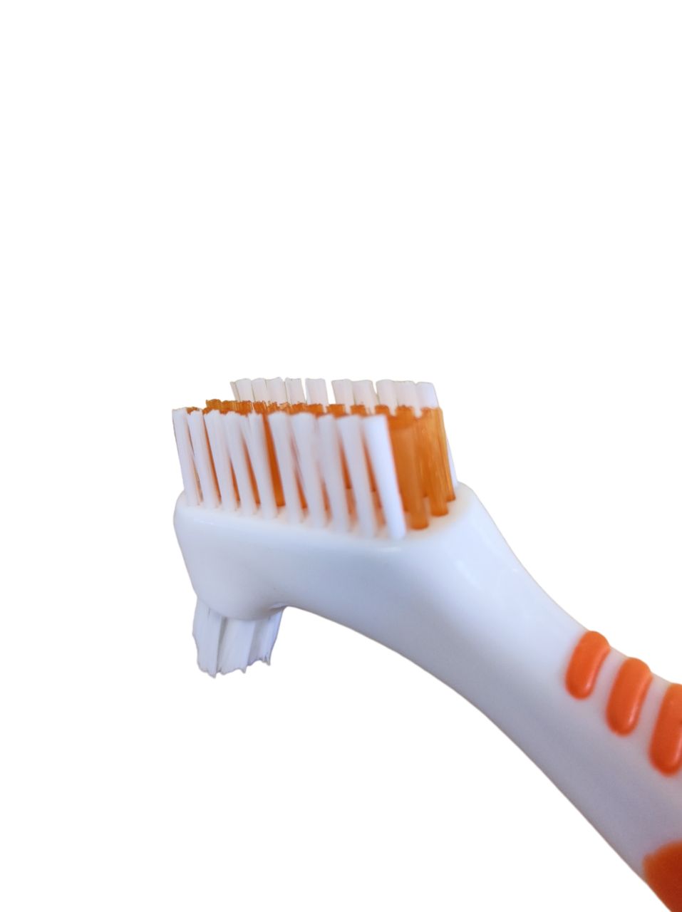 Brosse à dents pour prothèses, manche blanc avec accents orange. Soies blanches et orange.