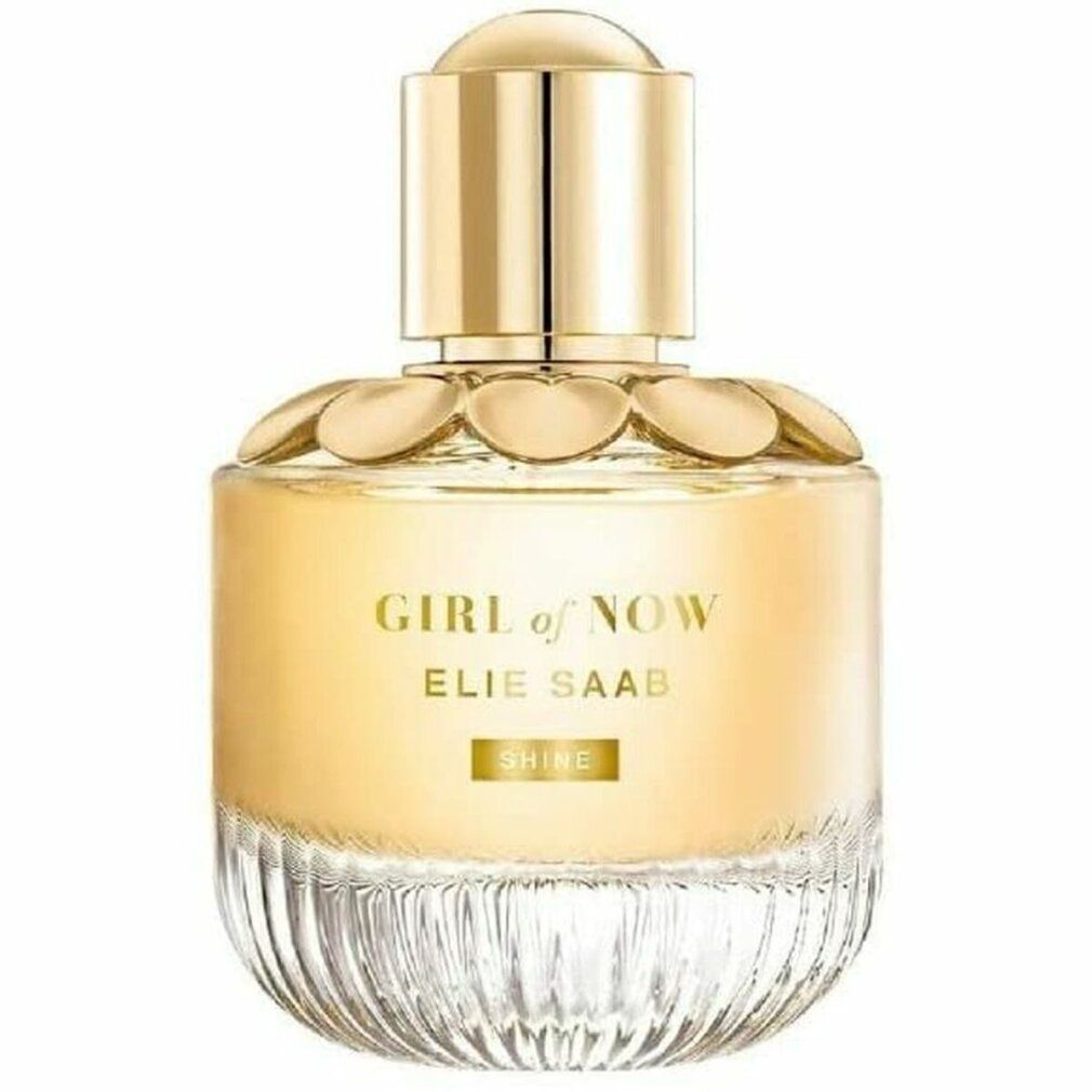 Flacon de parfum avec bouchon doré et design floral. Inscription 'GIRL of NOW' et 'ELIE SAAB'.