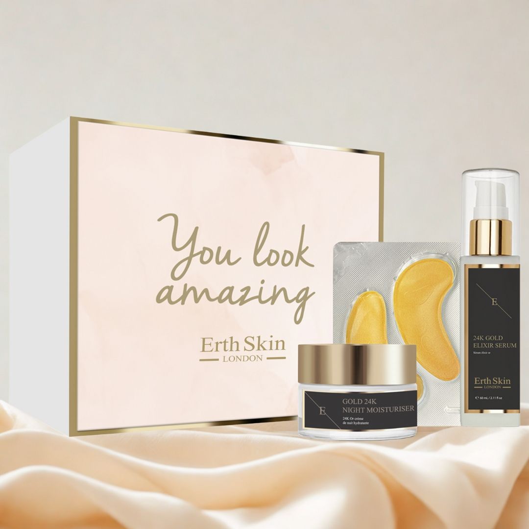 Coffret cadeau de soins de la peau. Crème, sérum, patchs pour les yeux. Accents dorés. Texte: "You look amazing", "Erth Skin London".