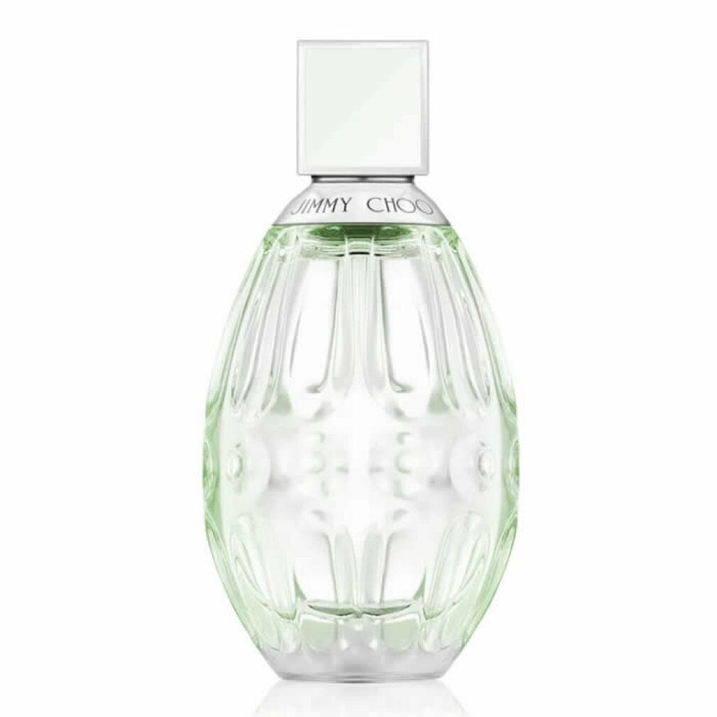 Transparante, ovale parfumfles met geribbelde oppervlakte. Witte dop. Productnaam op de fles.