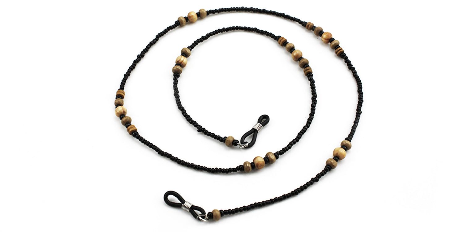 Cordon à lunettes avec perles noires et perles en bois. Boucles métalliques pour attacher aux lunettes.