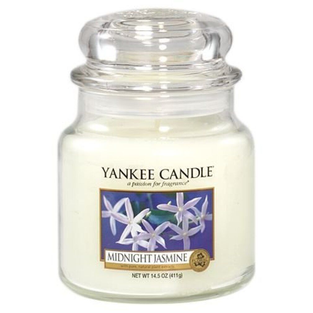 Yankee Candle Midnight Jasmine geurkaars. Glazen pot met deksel. Blauw etiket met bloemen. Gewicht: 411g.