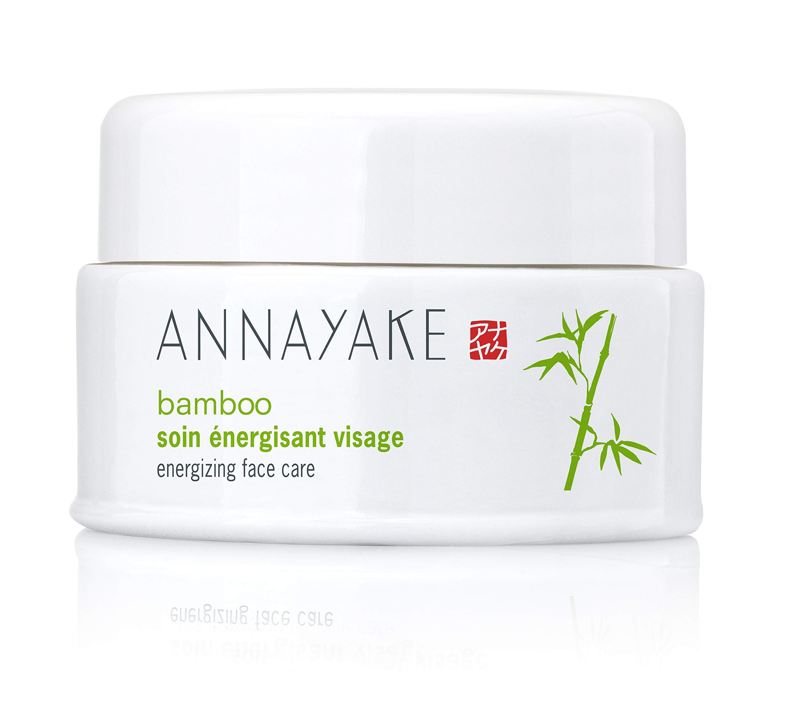 Pot blanc avec couvercle. Inscription: ANNAYAKE, bamboo, soin énergisant visage, energizing face care. Logo et illustration de bambou.