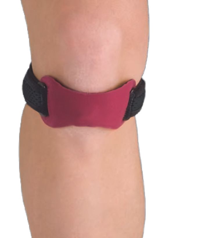 Kniebandage met siliconen drukpad. Zwarte band, rood kussen. Gedragen op de knie.