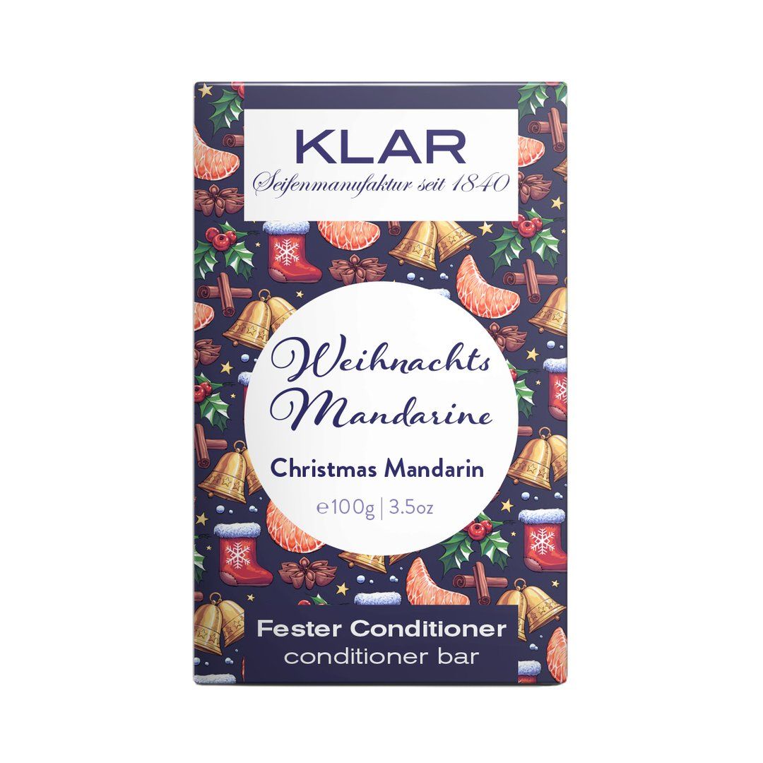 Emballage de barre revitalisante Klar-Seifen. Design bleu et blanc avec décor de mandarine et de Noël. Texte : "Weihnachts Mandarine", "Fester Conditioner".
