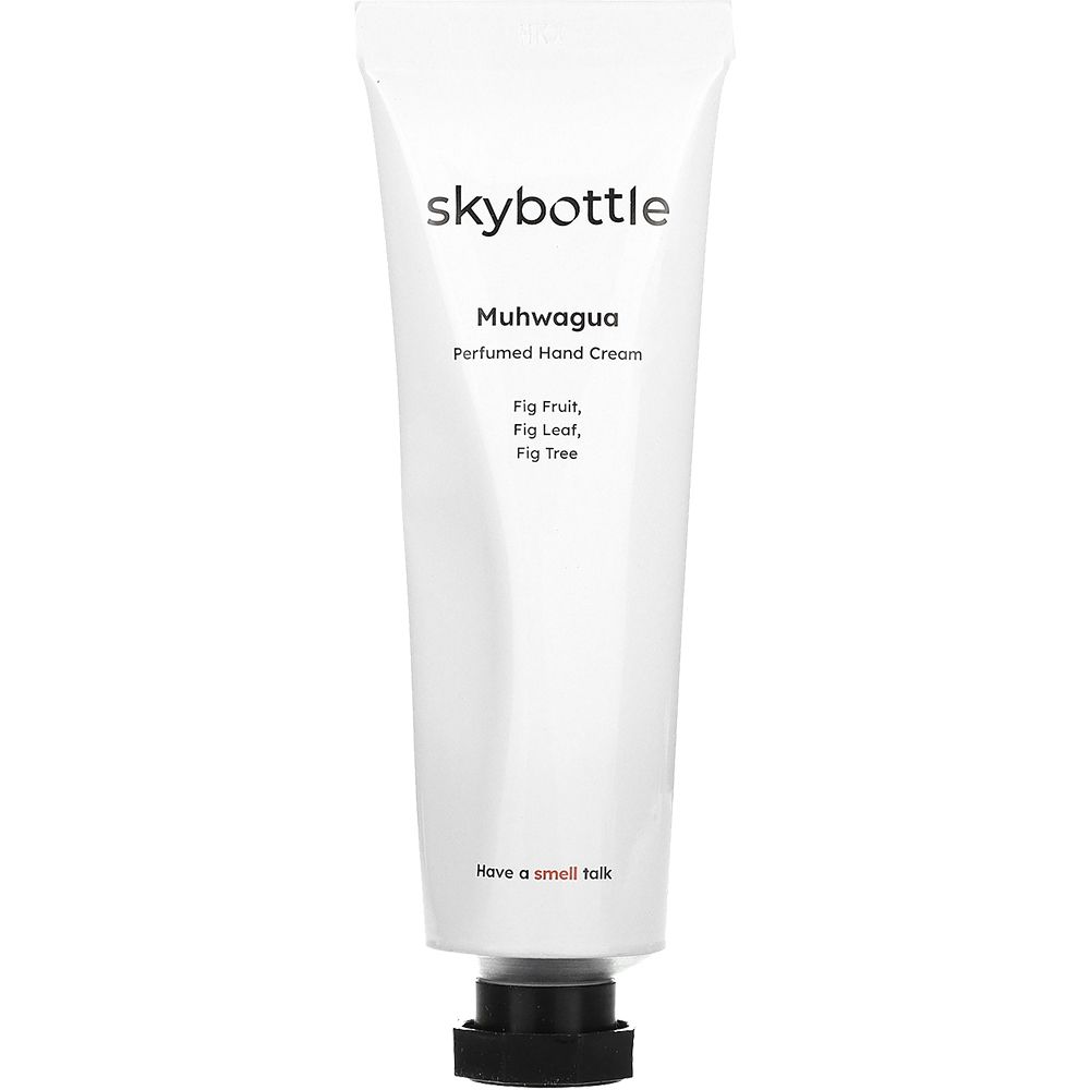 Tube blanche avec bouchon noir. Inscription: skybottle, Muhwagua Perfumed Hand Cream. Texte: Fig Fruit, Fig Leaf, Fig Tree.