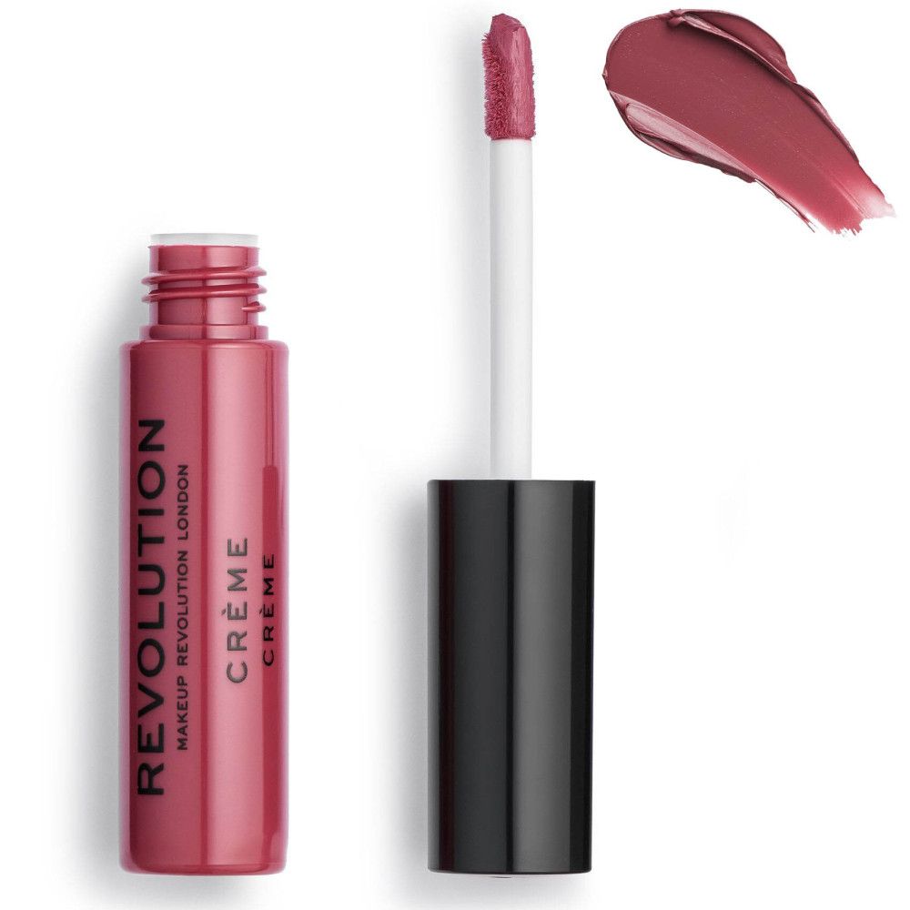 Tube de rouge à lèvres avec bouchon noir et applicateur. Échantillon de couleur à côté. "REVOLUTION" et "CRÈME" sont écrits sur le tube.