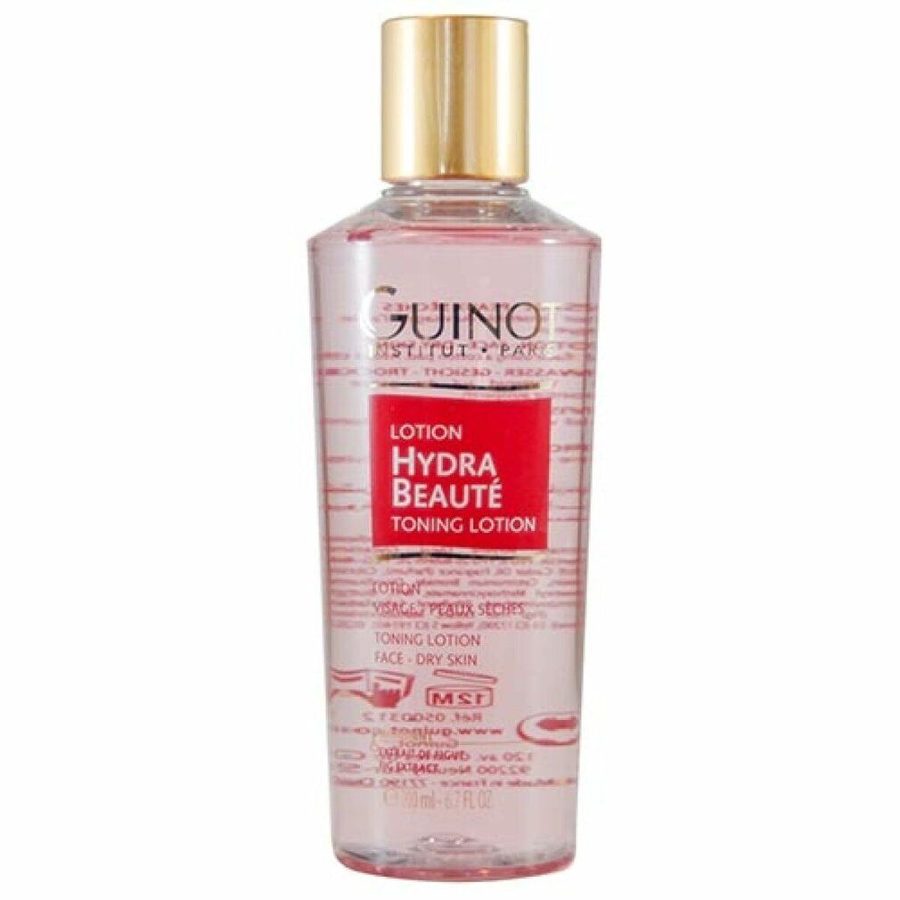 Guinot Hydra Beauté Toning Lotion. Roze vloeistof in een transparante fles met gouden dop. Rood etiket met tekst.