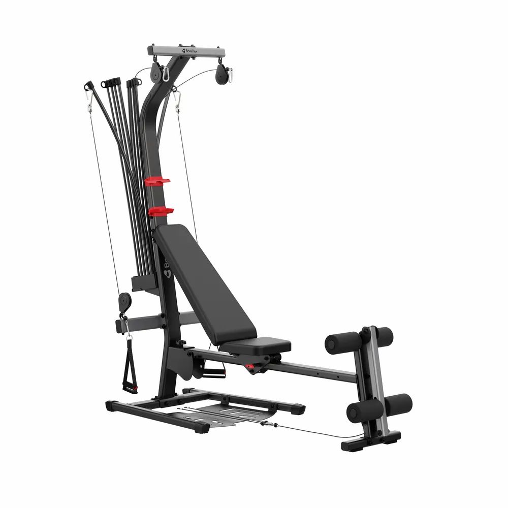 Appareil de fitness domestique noir et gris avec barre d'haltères, poids et siège.