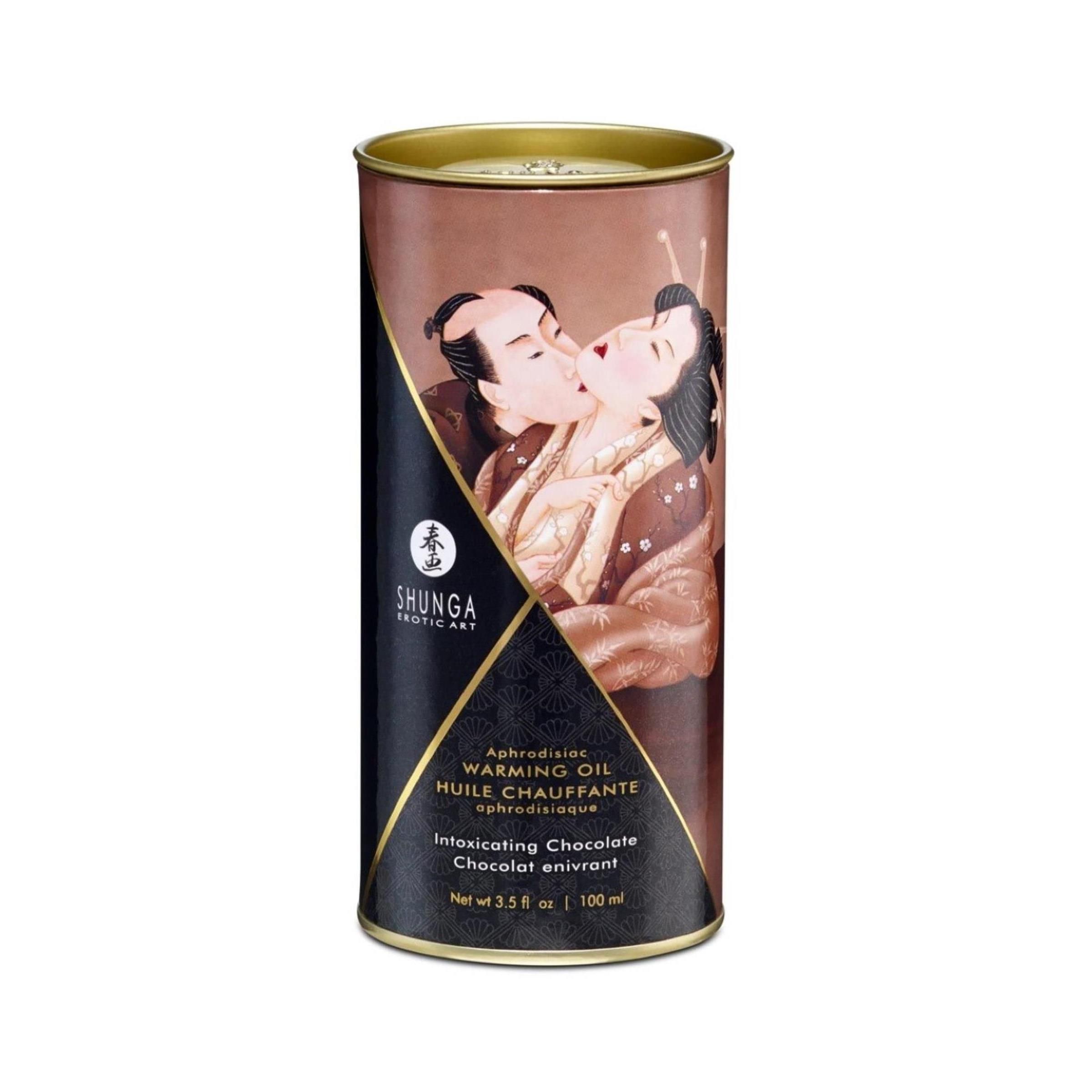 Cilindrische doos met afbeelding van een paar. Tekst: Shunga, Warming Oil, Intoxicating Chocolate.