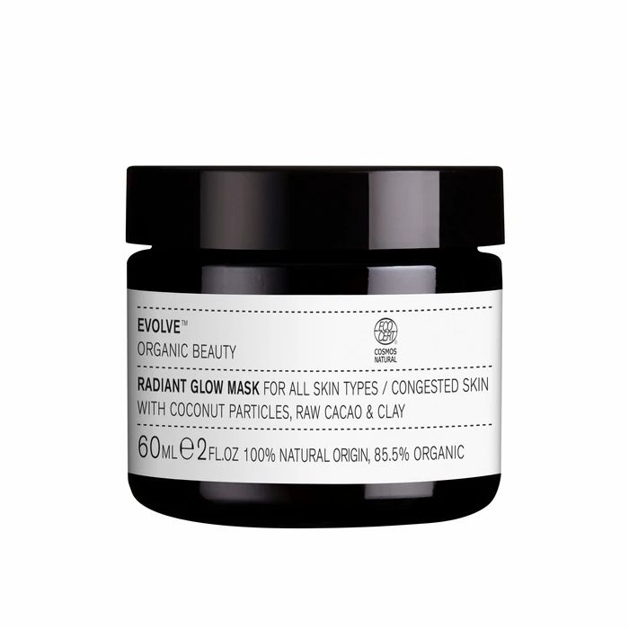 Pot noir avec étiquette blanche. Inscription: Evolve, Radiant Glow Mask, 60ml, 100% Natural Origin, 85.5% Organic. Certification Cosmos Natural.