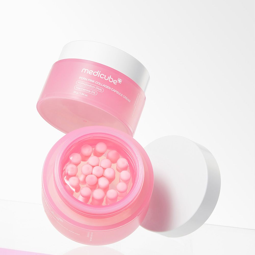 Twee potten Medicube PDRN Pink Collagen Capsule Cream, één open met roze capsules in gel.