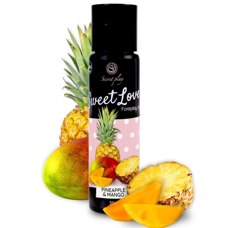 Massagegel met ananas- en mangogeur, omringd door vers fruit. Zwarte fles.