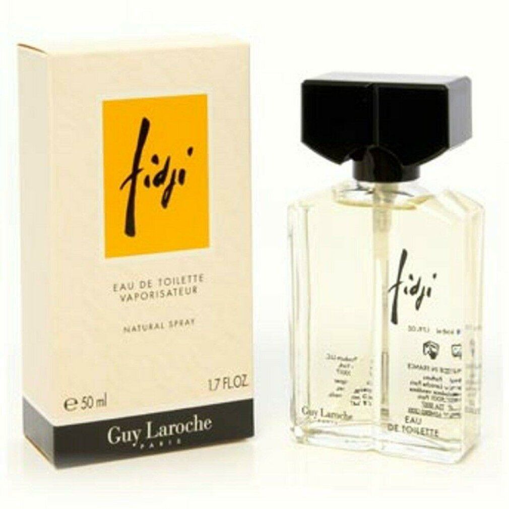 Fidji Eau de Toilette Spray van Guy Laroche. Fles en verpakking. Gele vloeistof in glazen fles met zwarte dop.