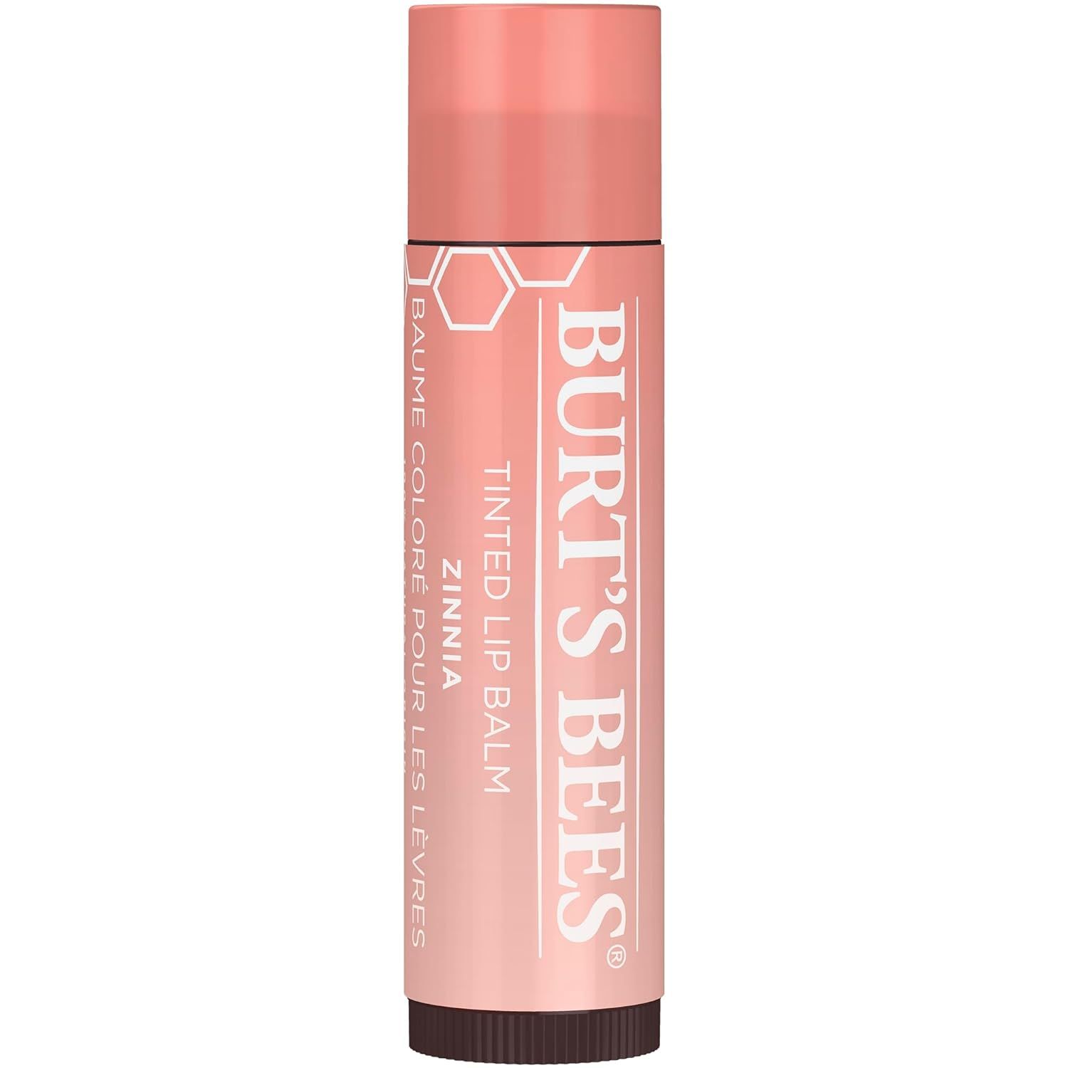Baume à lèvres teinté Burt's Bees Zinnia. Bâton de baume à lèvres rose avec texte blanc. Logo en nid d'abeille. Bouchon en haut.
