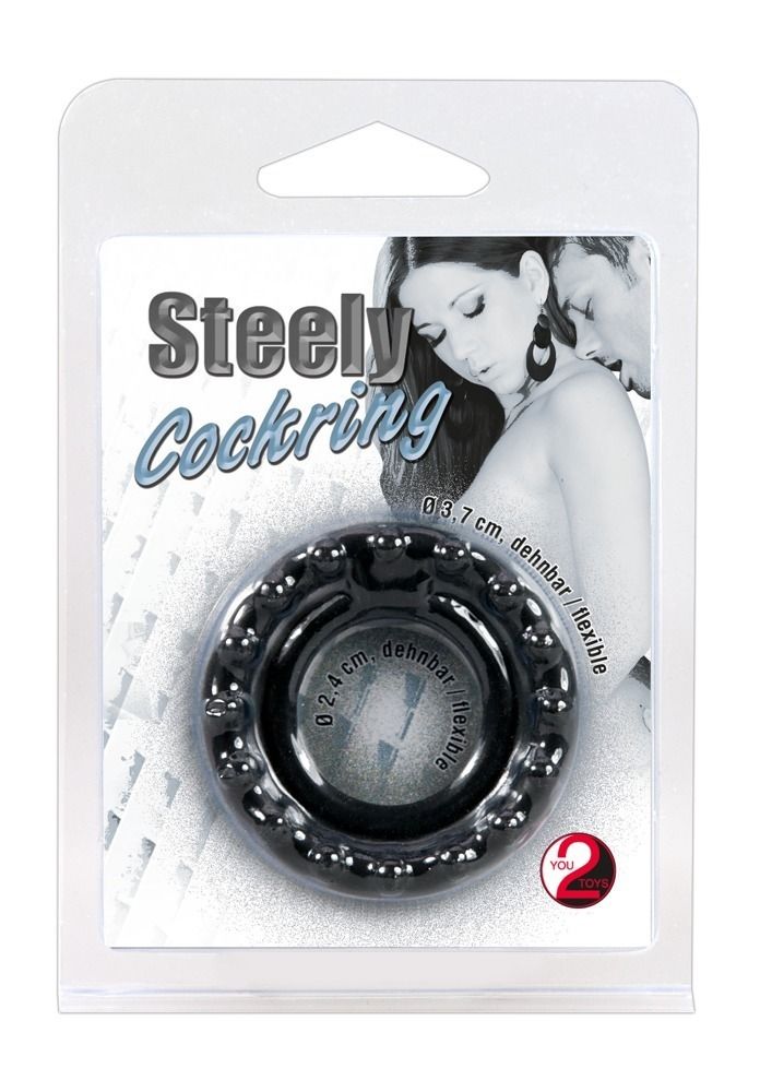 Verpakking met penisring. De ring is zwart en heeft noppen. Productnaam, afmetingen en logo gedrukt.