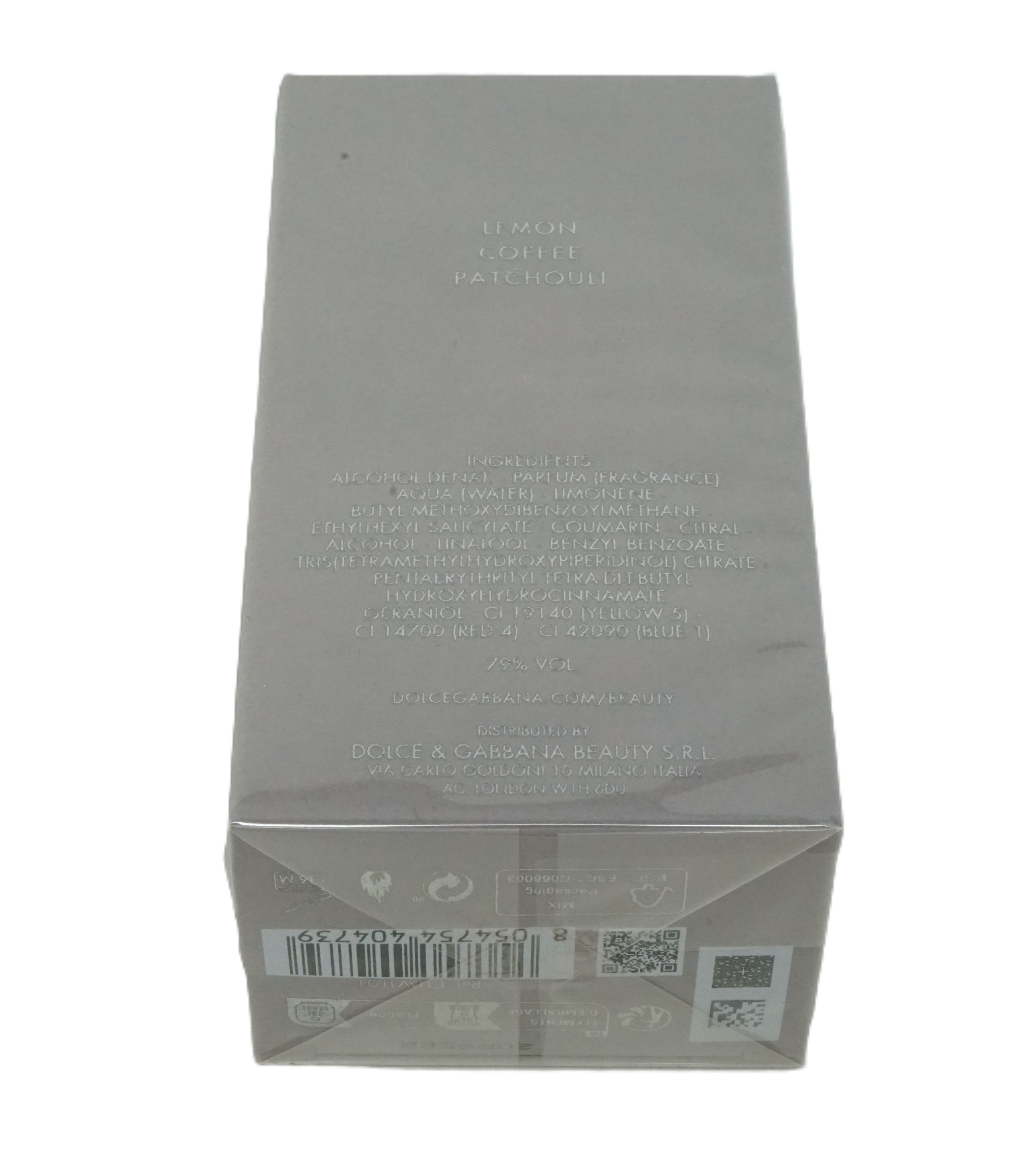 Grijze rechthoekige verpakking. Tekst: Dolce & Gabbana Beauty, ingrediënten, barcode. Achteraanzicht.