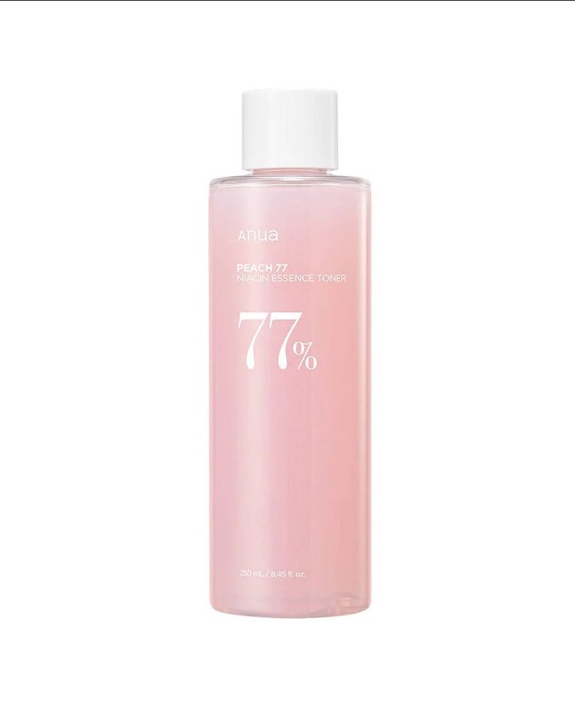 Anua Peach 77 Niacin Essence Toner dans une bouteille transparente avec un bouchon blanc.