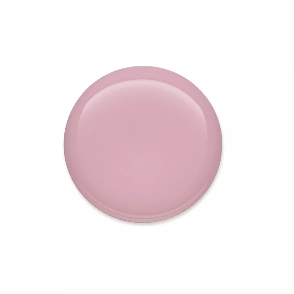 Tache ronde de vernis à ongles rose. Surface brillante. Aucun autre détail visible.