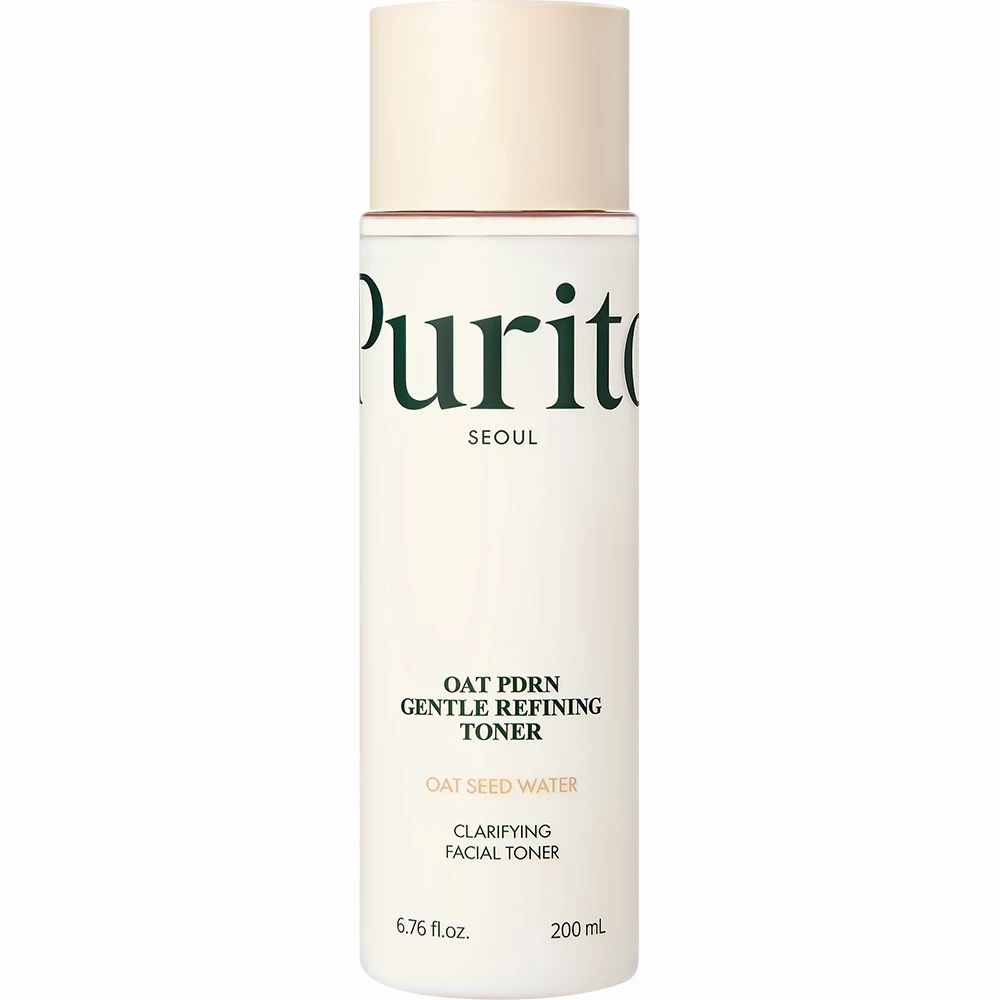 Witte fles met beige dop. Opschrift: Purito, Oat PDRN Gentle Refining Toner, Clarifying Facial Toner.