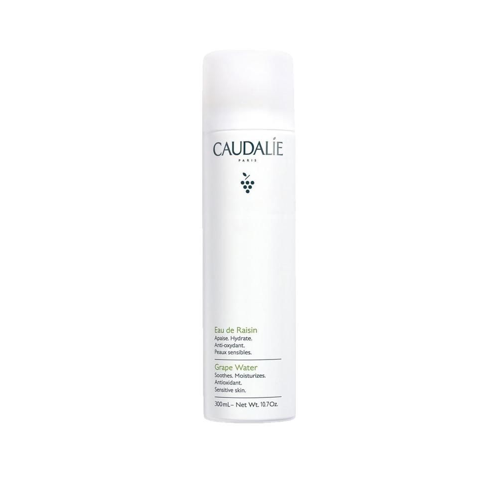 Flacon blanc Caudalie Eau De Raisin. Inscription: Eau de Raisin, Grape Water. Bouchon blanc.