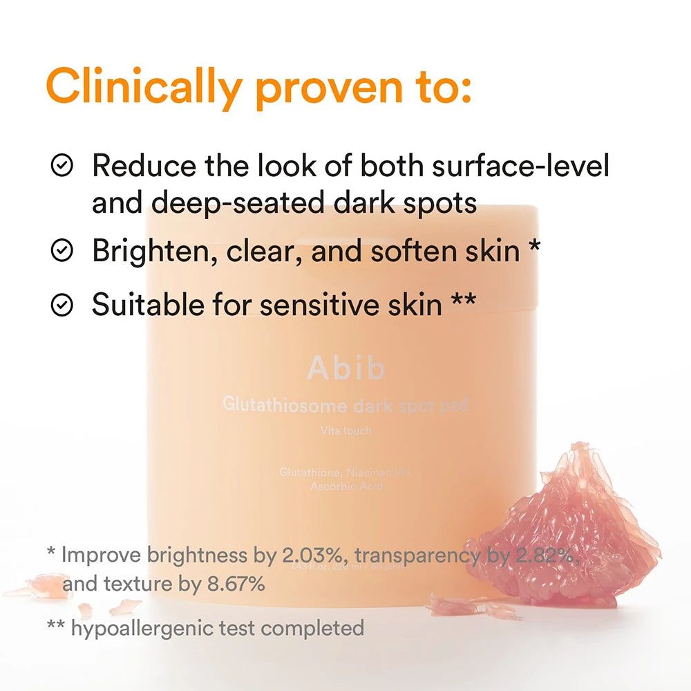 Abib Glutathiosome Dark Spot Cream in een perzikkleurige container, naast een grapefruit. Klinisch bewezen om donkere vlekken te verminderen.