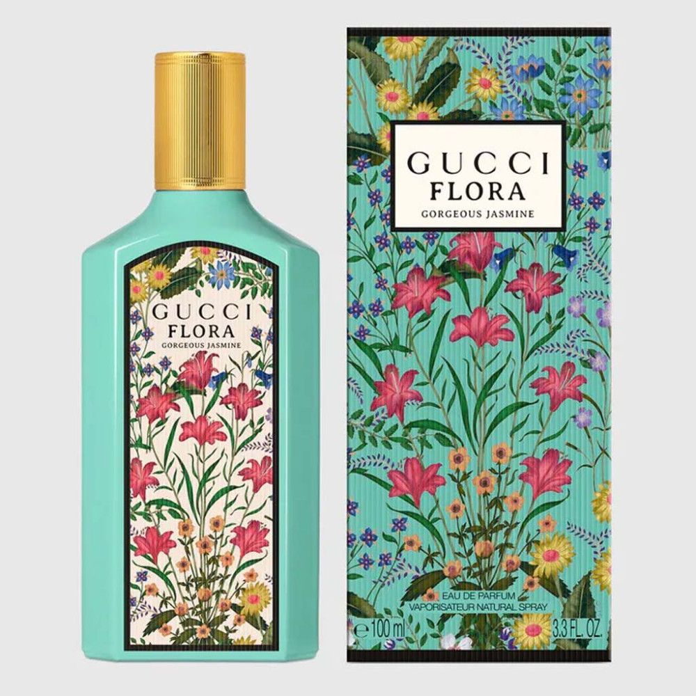 Turquoise fles en doos met bloemenpatroon. Opschrift: Gucci Flora Gorgeous Jasmine. 100ml.