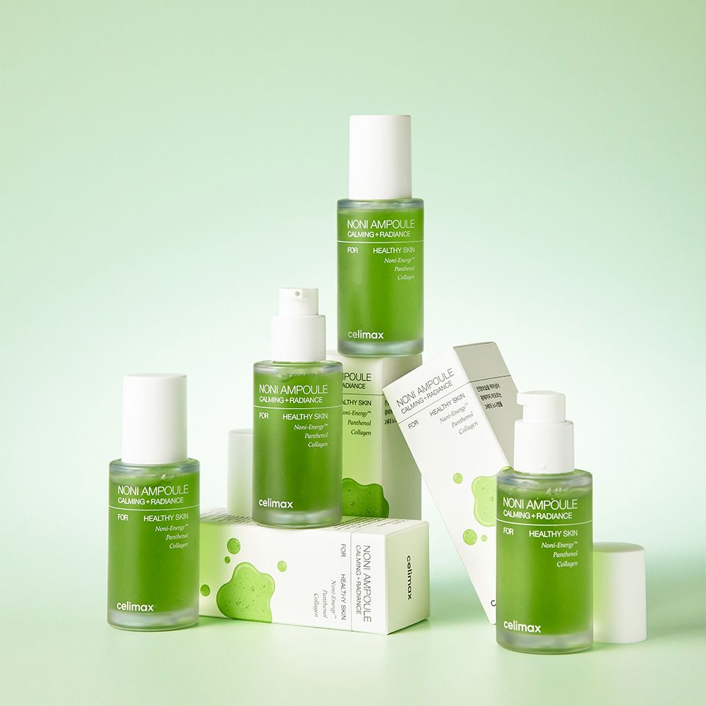 Plusieurs ampoules et boîtes Celimax Noni Energy sur fond vert clair.