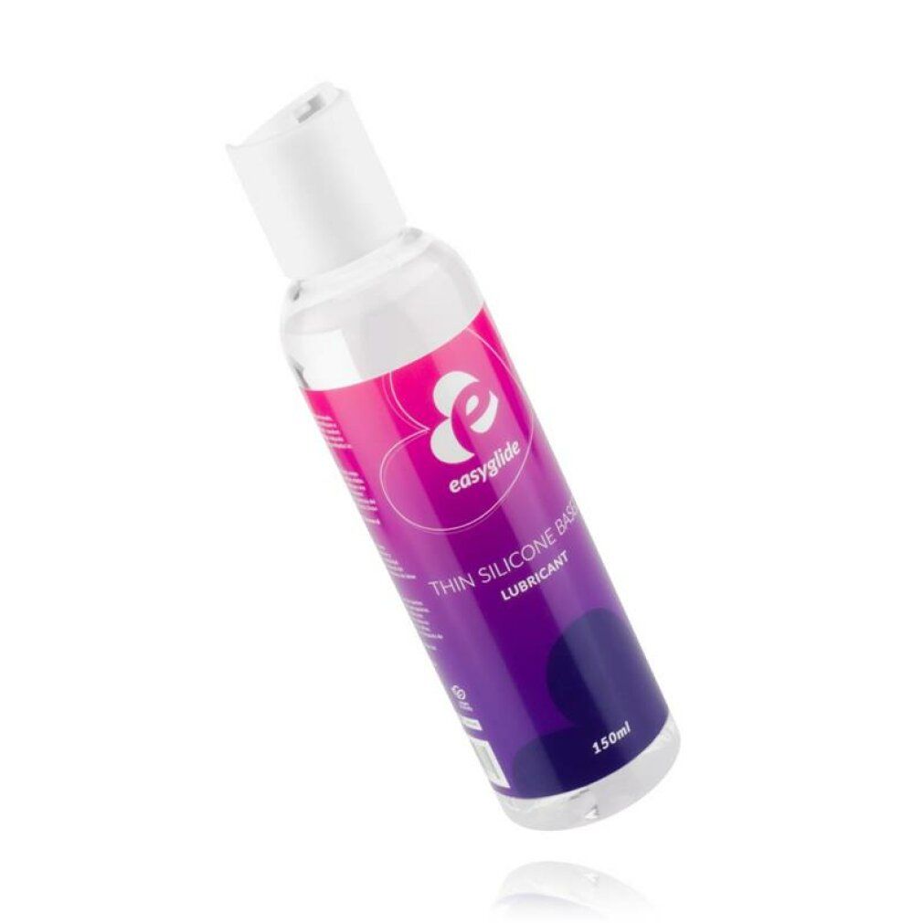 Schuin geplaatste, transparante fles met witte dop. Etiket met logo en tekst. Opschrift: Thin Silicone Based Lubricant.