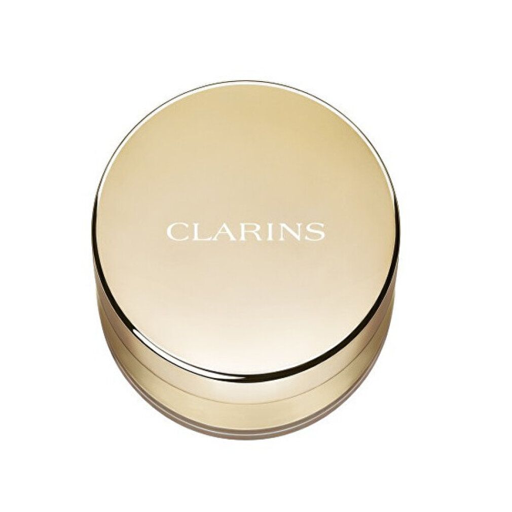 Boîtier rond doré avec logo CLARINS.