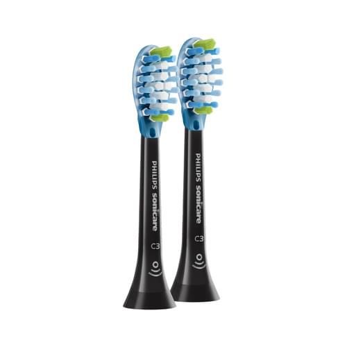 Deux têtes de brosse Philips Sonicare C3. Soies bleues et accents verts. Manche noir avec logo.