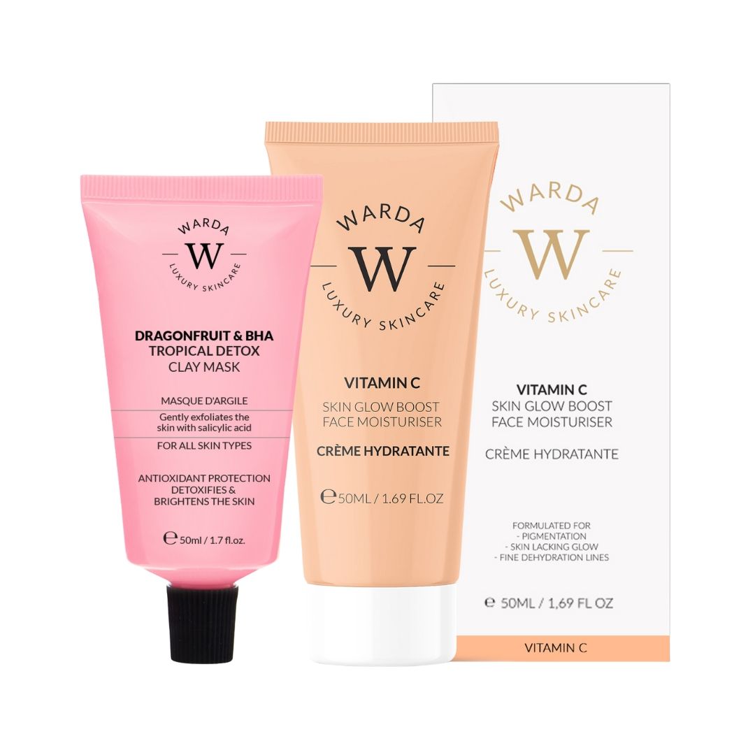Roze tube met zwarte dop, oranje tube, witte doos. Opschrift: Warda Luxury Skincare, Vitamine C, Moisturizer.