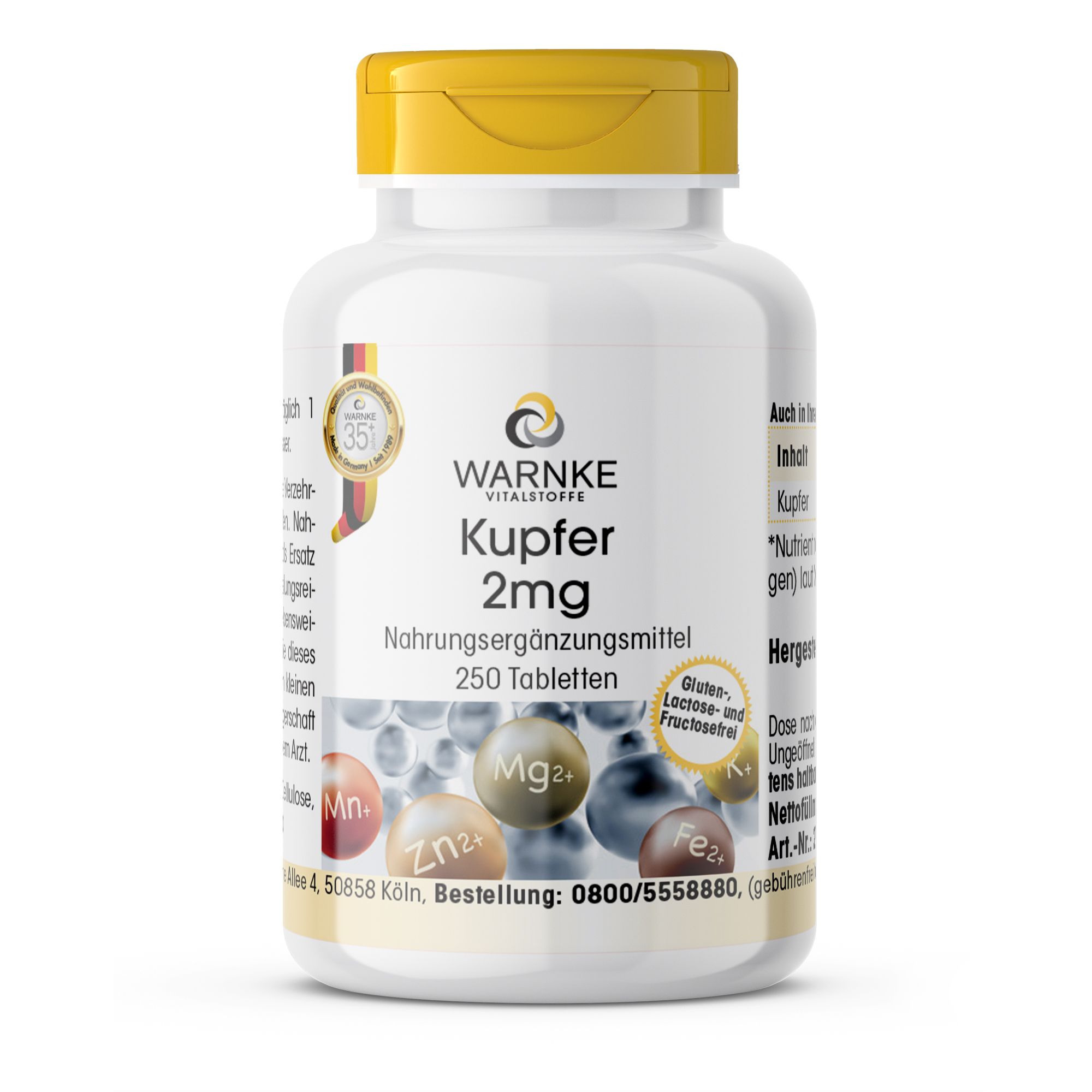 Witte fles met gele dop. Opschrift: Warnke Vitalstoffe Kupfer 2mg, 250 tabletten. Voedingssupplement. Met mineralen grafiek.